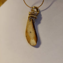 Load image into Gallery viewer, This 1.25&quot; x .75&quot; Fossil Walrus Ivory Pendant is many thousands of years old. It was found in Alaska on the Bering Sea coast. Hung on a 22&quot; 18Kplt Gold Chain. Wire Wrapping by Tina of Mammoth Ivory Creations Studio 
