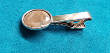 Load image into Gallery viewer, This Silver Tie Clip has been crafted from 35,000 year old Alaskan Fossil Mammoth Ivory. 1&quot; in diameter. 

