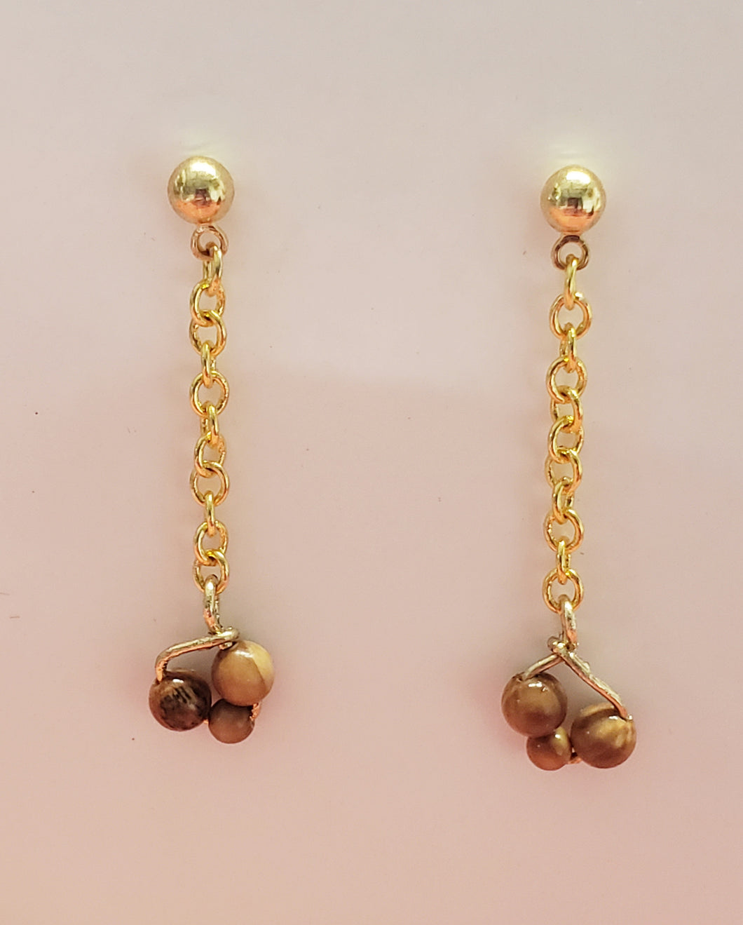 These 2 and 3 mm Mammoth Ivory bead earrings have been crafted from Fossil Mammoth Ivory found in Siberia. Their rich organic color is absorbed from the soil that they have laid in for close to 30,000 years.