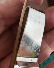 Load image into Gallery viewer, This Money Clip is my first real carving in several years since the loss of my Eyesite. It was a real challenge to accomplish this piece by feel and real great magnification. It is rustic and one of a kind, Hand carved from Alaskan Mammoth Ivory that is a
