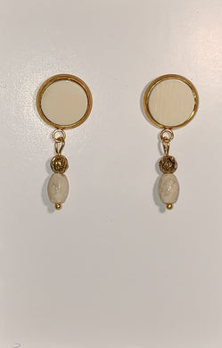This delicate little set of 10,000 year old Fossil Mammoth Ivory Earrings are less than a half inch in size. they are highlighted with oval Fossil Mammoth Ivory Beads, The findings are Gold plates stainless steel.