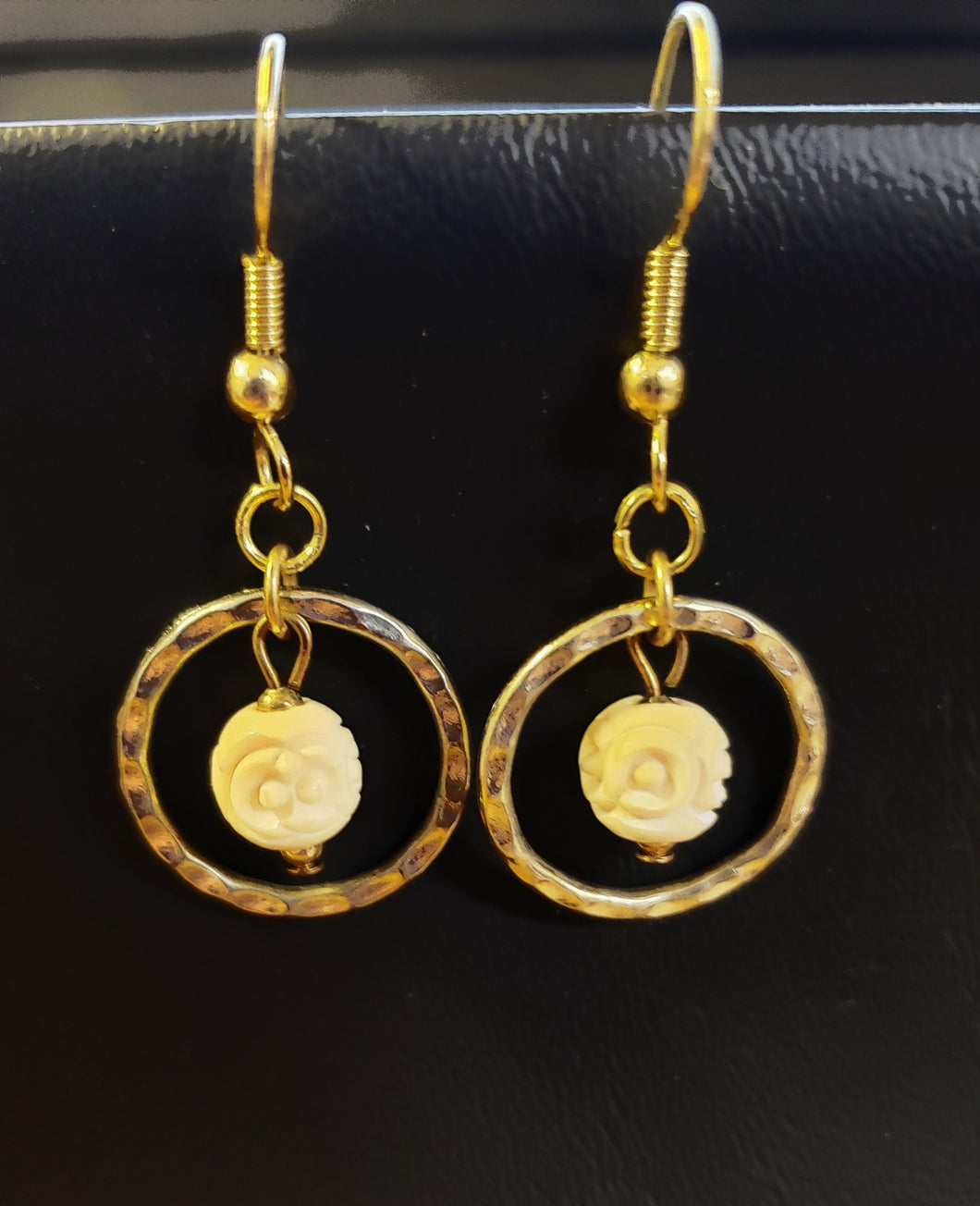 Adorn yourself in the ancient beauty of these Hand Carved Fossil Mammoth Ivory Bead Earrings. 10,000 years old with a design inspired by 13th century China.