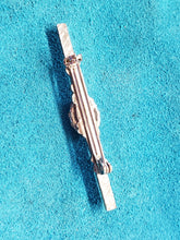 Load image into Gallery viewer, This 2&quot; Scrimshawed Brooch could also be used as a tie tack. It has been crafted from silver and Fossil Mammoth Ivory. Artist unknown. 2&quot;× .50&quot;
