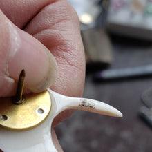 Load image into Gallery viewer, This gorgeous hand carved Tie Tack has been crafted from Fossil Walrus Ivory by an unknown Alaskan artist sometime in the 1950s or sixties. 
